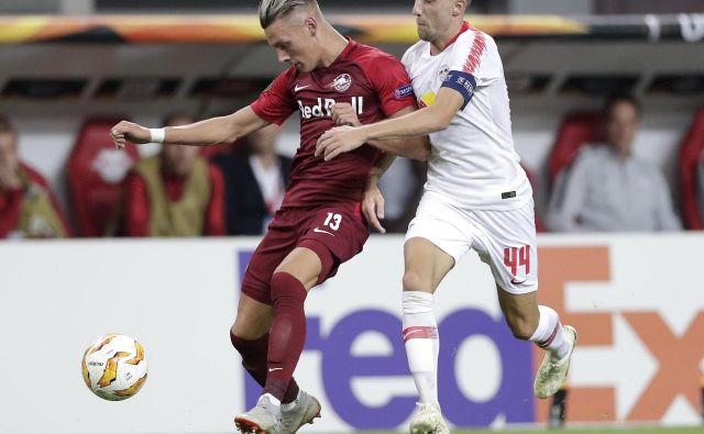 Kevin Kampl je s kapetanskim trakom na roki ostal praznih rok. FOTO: Michael Sohn/AP