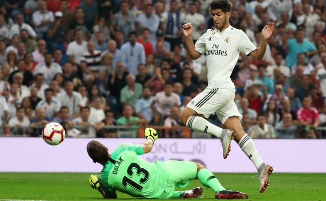 Jan Oblak je tretjič zapored ostal nepremagan. FOTO: Sergio Perez/Reuters