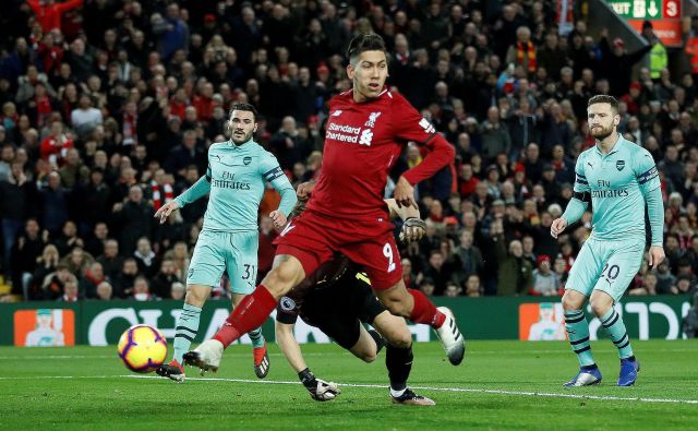 Roberto Firmino je dosegel prvi trojček golov v Liverpoolovi majici. FOTO: Carl Recine/Reuters