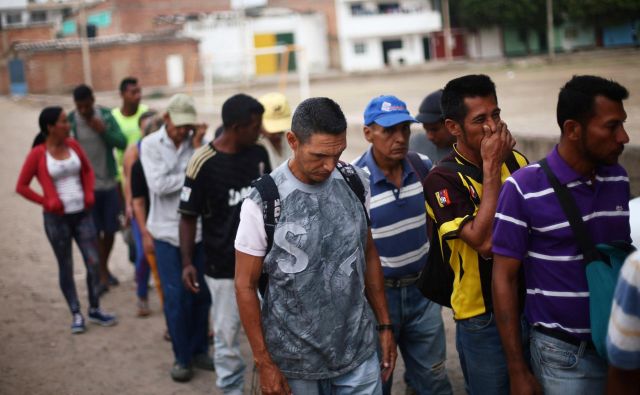 Venezuelo je v zadnjih petih letih zapustilo več kot dva milijona ljudi. Na fotografiji migranti v Cucuti, mestu na meji med Venezuelo in Kolumbijo. FOTO: Edgard Garrido/Reuters