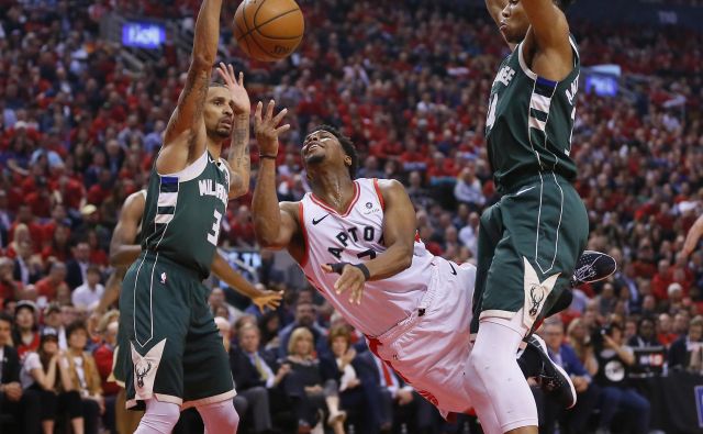 Kyle Lowry (na sredini) je k zmagi Toronta tokrat prispeval 25 točk. FOTO: Usa Today Sports