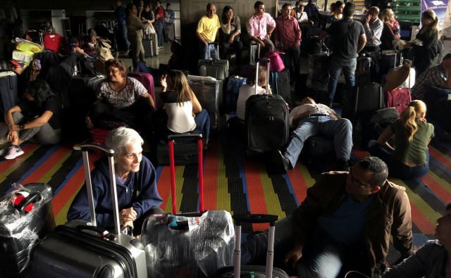 Doslej je urad prejel 17 prošenj za repatriacijo 52 ljudi slovenskega porekla in njihovih družinskih članov. FOTO: Marco Bello/Reuters