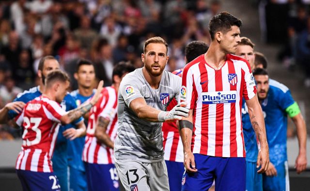 Jan Oblak bo čuval vrata Atletica, Alvaro Morata bo napadal vrata svojega nekdanjega kluba Reala. FOTO: AFP