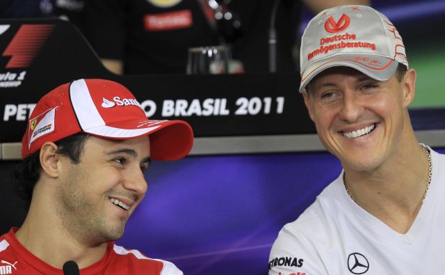 Felipe Massa (levo) močno upa, da se bo Michael Schumacher nekega lepega dne spet pojavil na dirkališču. FOTO: Reuters