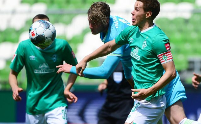 Wolfsburg je odnesel ves plen iz Gelsenkirchna. Desno edini strelec Wout Weghorst. FOTO: AFP
