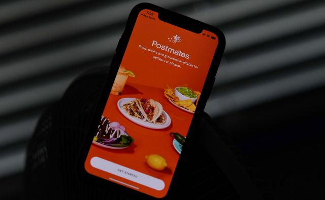 Uber bo za Postmates plačal 2,65 milijarde dolarjev. FOTO: Chris Delmas/AFP