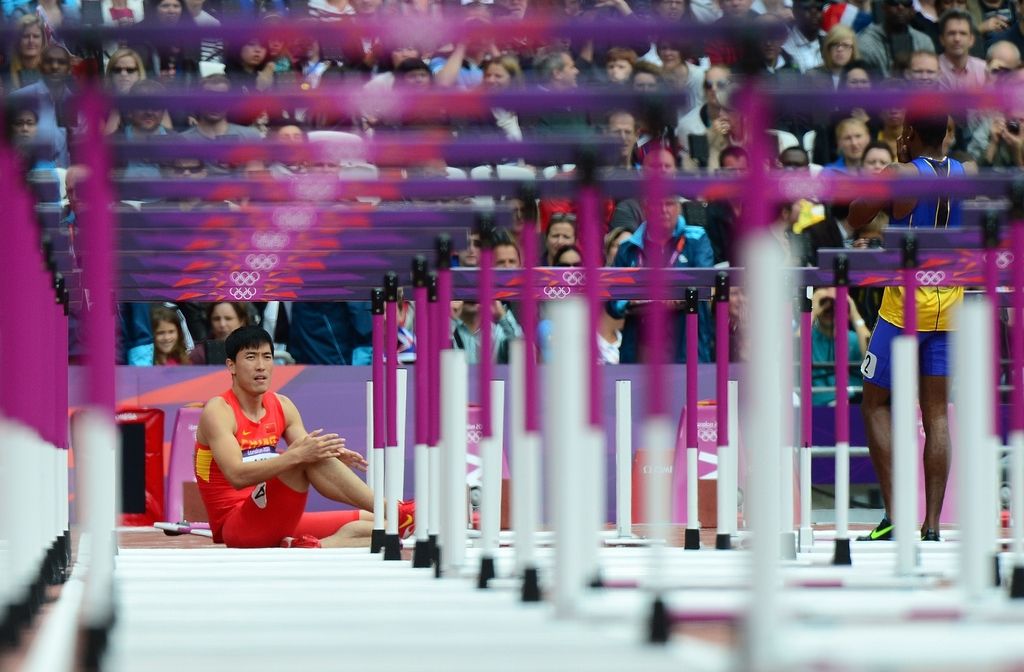 Liu Xiang doživel nov olimpijski šok, Bolt zanesljiv na 200 m