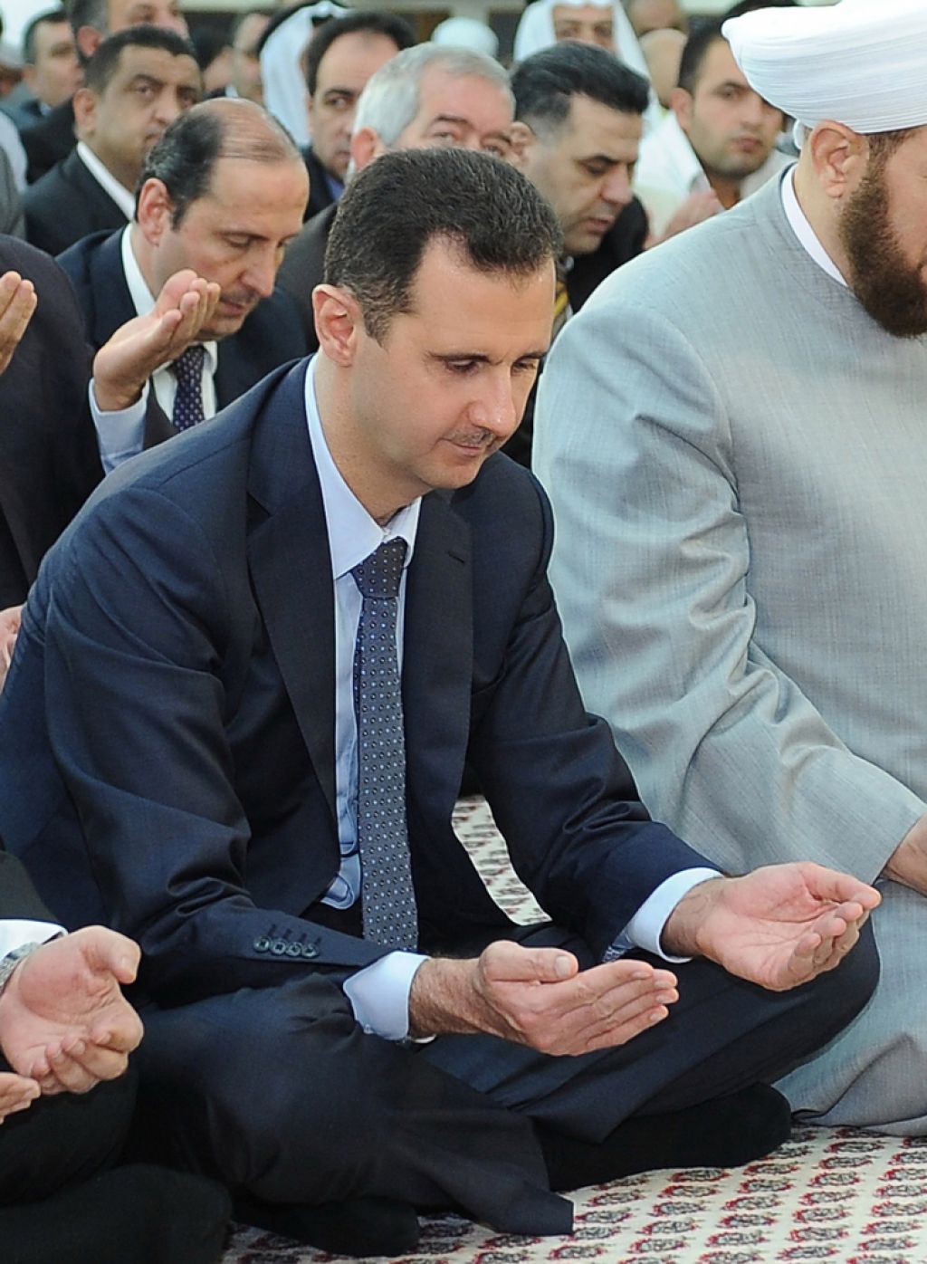 Asad prepričan, da njegov režim čaka drugačna usoda kot Gadafijev